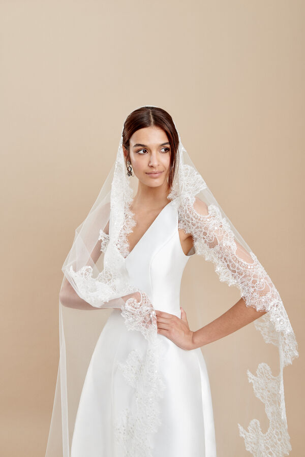 Oval cut tulle veil with a Chantilly lace edge embroidered with sequins