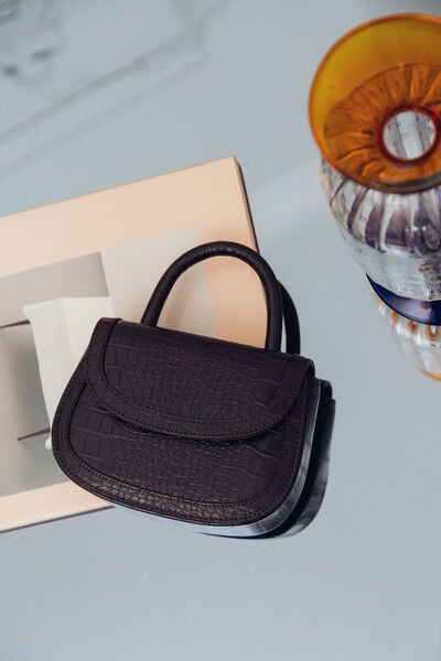 Crocodile print mini handbag
